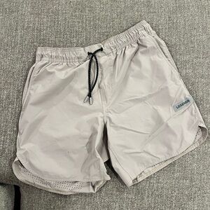 Tan Legends shorts (m) 7” inseam Briefs inside